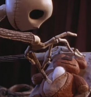Jack Skellington dissecting a teddy bear to understand what makes Christmas so lovely.