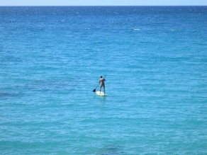 Me, buck naked, paddling into the horizon. (Hawaii)