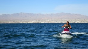 Riding the lake with Havasu City in the background.