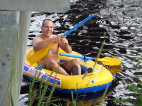 Tomas rowing his little boat.